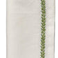 A folded white linen napkin from the Kim Seybert Jardin Napkin Set, featuring green leaf embroidery on two edges. "White/Green" text appears at the bottom.