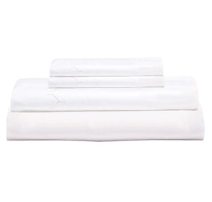 The Stitched White Sheet Set by John Robshaw, made from organic cotton, is neatly stacked on a plain background, offering a fresh and inviting look.