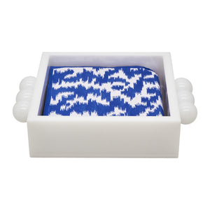 The Tizo Design Acrylic Napkin Holders with Bubble Handles display folded blue and white patterned napkins, bringing a modern touch to your table decor.