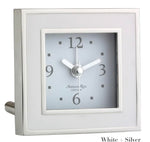 The Square Silver Alarm Clock Collection by Addison Ross features a silver and white design, displays 10:09, and is ideal for a bedside table.