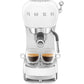 Front view of a SMEG Espresso Machine Collection by Smeg, showing two glass cups under the dual spout with rich coffee, made possible by its Thermoblock heating system and 15 bar pressure.