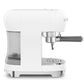 The SMEG Espresso Machine Collection by Smeg features a sleek white design, Thermoblock heating system, left-side water tank, right-side portafilter, and 15 bar pressure for optimal flavor extraction.