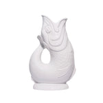 The Original Gluggle Jug's Fish Gluggle Jug Collection features glossy white ceramic jugs shaped like fish, with detailed scales and an open-mouth spout—a true British design icon.