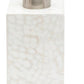 A rectangular white soap dispenser with a mosaic texture and silver pump from the Callas Bath Collection by Pigeon & Poodle.