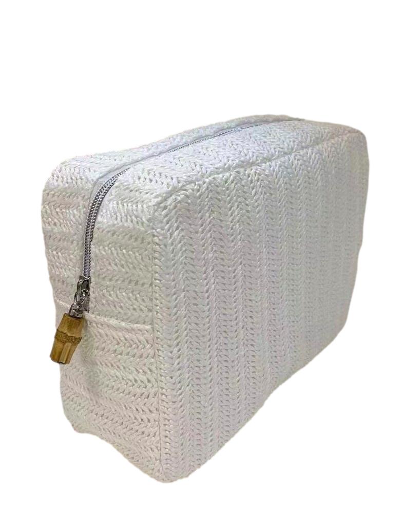 The Big Glam Bag in Straw White by TRVL Design features a rectangular shape, textured chevron pattern, tan pull tab, and zipper closure—an eco-friendly choice for style and sustainability.