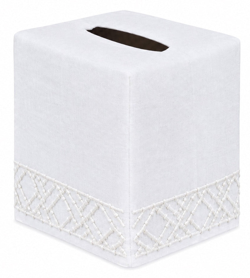 The Lido Bath Collection tissue box cover from Haute Home is a white square design crafted from premium linen, featuring an embroidered geometric pattern along the bottom edge—photographed on a plain background for an elegant addition to your home décor.