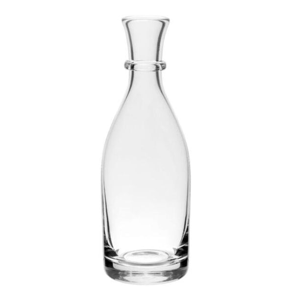 The sophisticated William Yeoward Crystal Whitney Tall Carafe, resembling a refined vessel with its slender neck and flared top, stands upright on a white background. It could seamlessly fit into the distinguished Whitney Collection from William Yeoward Crystal.