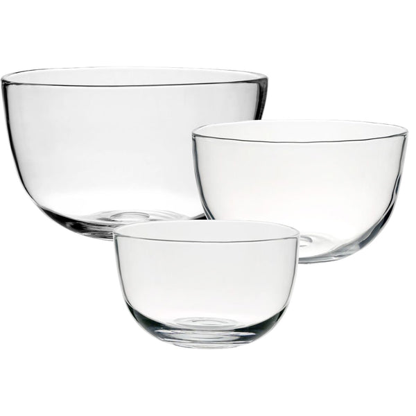 A stunning display of three transparent glass bowls from the William Yeoward Crystal Whitney Deep Bowl Collection are arranged in a cluster against a pristine white background, making an ideal centrepiece or versatile serving set.