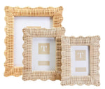 The Wicker Weave Scalloped Frame Collection by Two's Company features three empty hand-woven rectangular frames with wavy edges, displayed against a white background—ideal for enhancing any neutral decor.