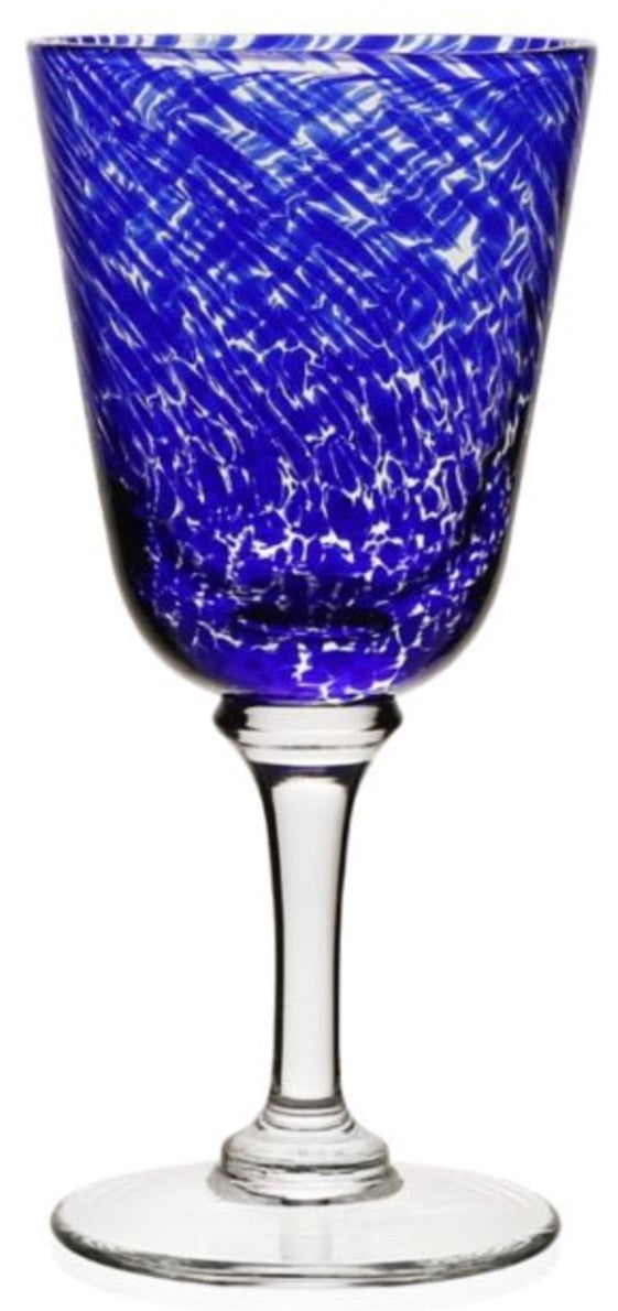 A blue bowl goblet with a clear stem from the Vanessa Blue Drinkware Collection by William Yeoward Crystal, featuring colored glass and a white textured swirl pattern that creates an optical illusion.