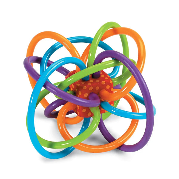 The Manhattan Toy Winkel Classic, a colorful, intertwined BPA-free plastic loops forming a spherical teether rattle toy with a textured orange ball at the center, is isolated on a white background.
