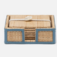 The Gable Natural/White Barware Collection by Blue Pheasant features a rectangular woven box with blue border, leather trim, open front, and lid secured by white cord and button.