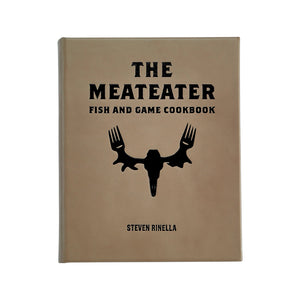 The Meateater Fish and Game Cookbook by Graphic Image is a beige hardcover featuring wild game recipes and an antler-fork graphic.