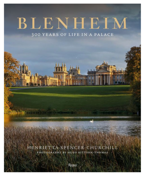 Rizzoli's "Blenheim: 300 Years of Life in a Palace" book cover highlights the majestic Blenheim Palace with its striking baroque architecture framed by a serene lake and vibrant autumn trees, celebrating English heritage.