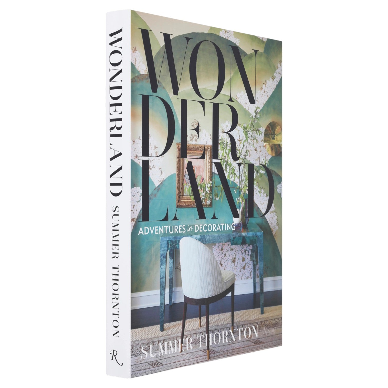 “Wonderland Adventures in Decorating” by Rizzoli is a renowned interior design book that showcases Summer Thornton’s signature maximalist style, with a cover featuring a striking chair set against a lush green wall.