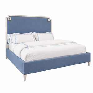 The Elise King Bed by Hickory Chair features a modern floating design with a blue upholstered frame and headboard, complemented by crisp white bedding and blue patterned pillowcases, set against a plain white background.