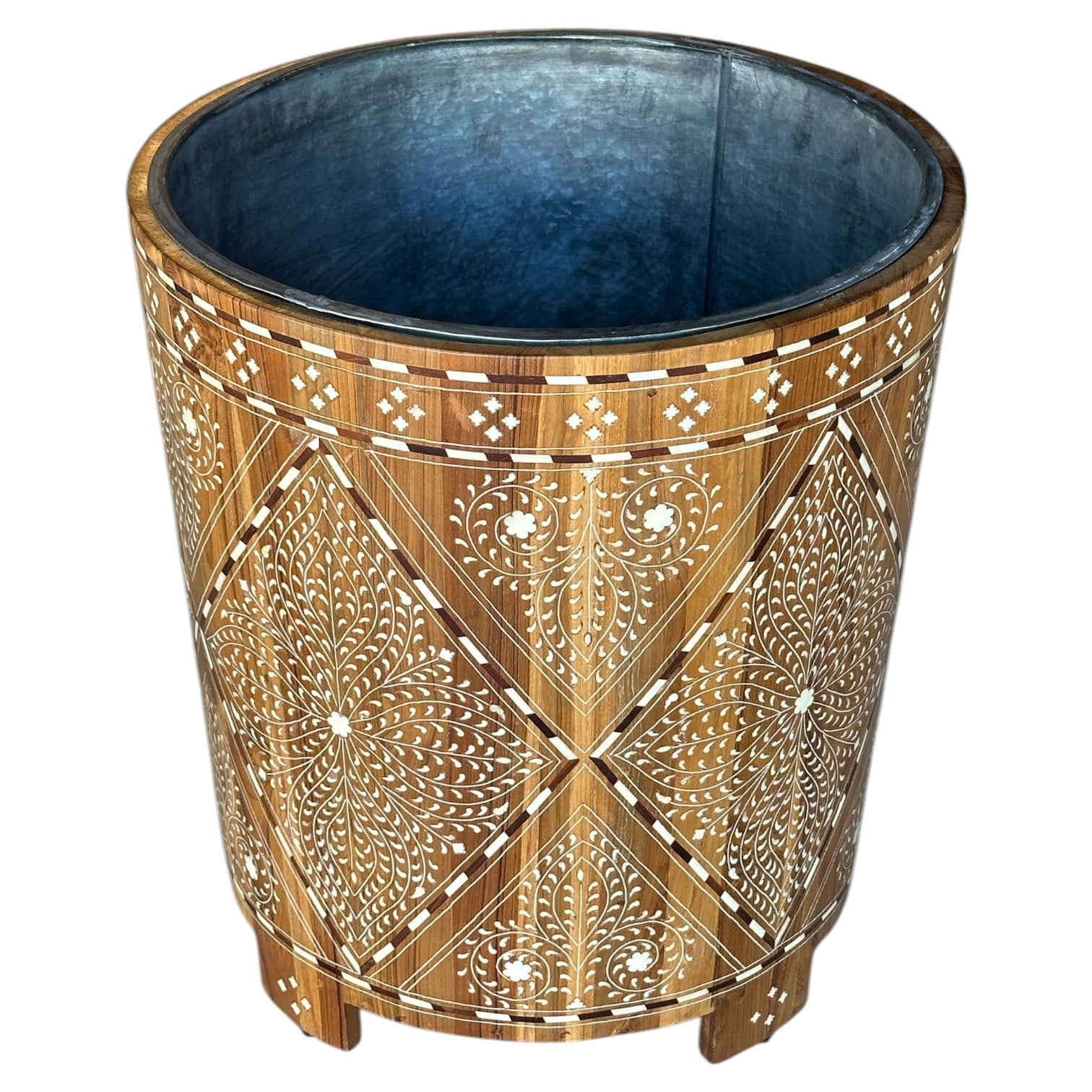 The Bojay Large Wood and Bone Planter is a cylindrical wooden piece with intricate white geometric and floral inlay, plus a metal-lined interior, bringing elegant style to your space.
