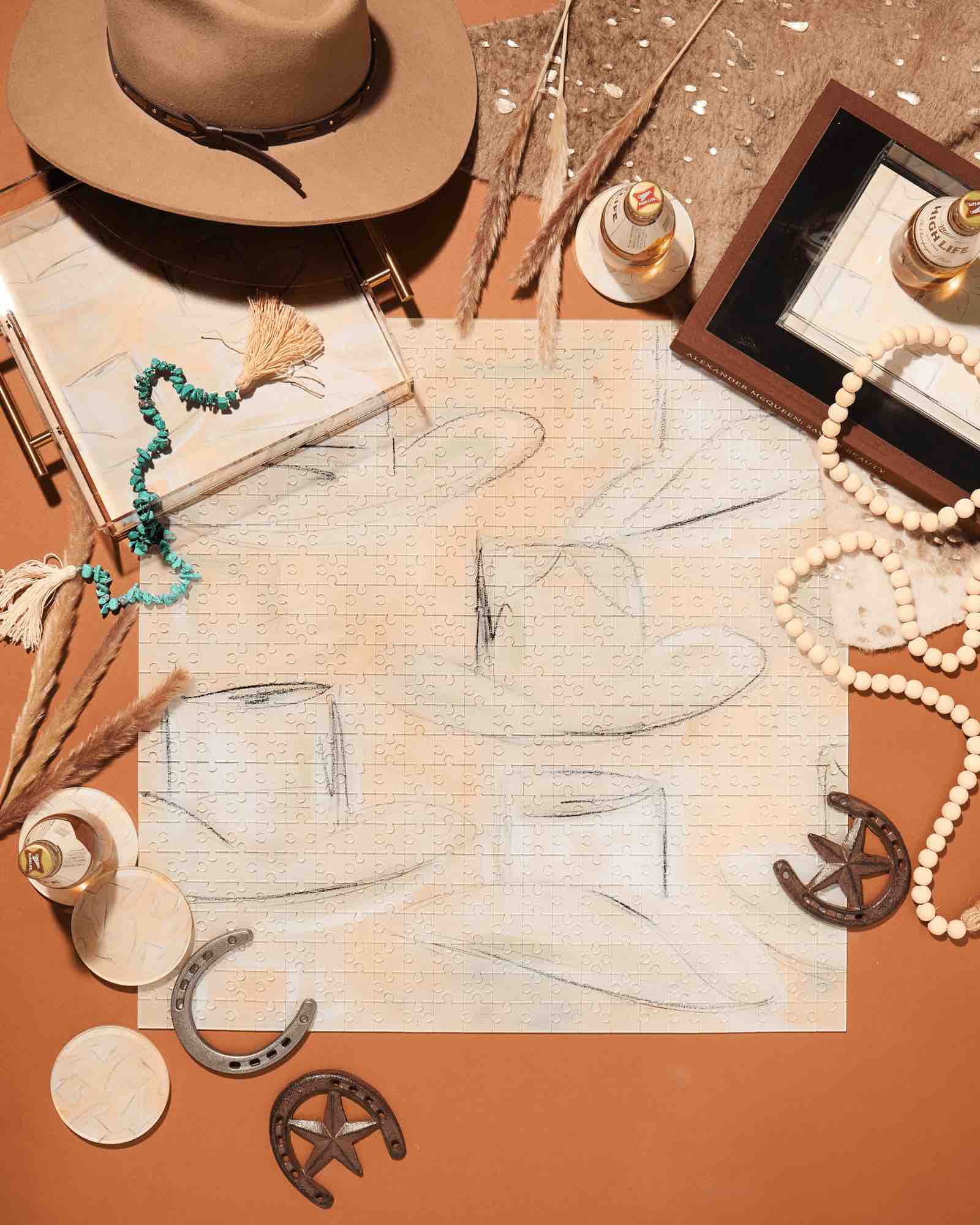 The Acrylic Puzzle by Tart by Taylor features abstract cowboy hats and comes with jewelry, drinks, horseshoes, and decorative items—a unique addition to your home decor.