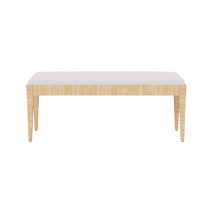The Wren Bench by Made Goods features a rectangular white rattan frame, light wood legs, and a white cushioned seat in high performance fabric, shown against a plain white background.