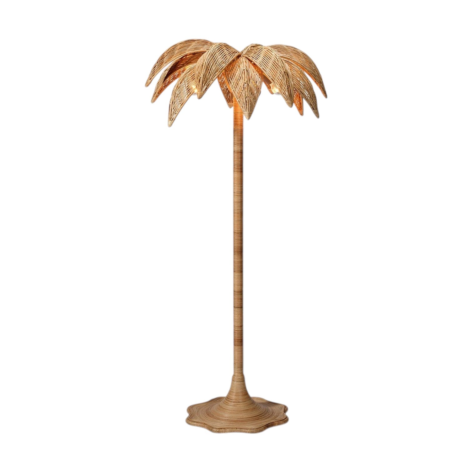 The Solana Floor Lamp by Made Goods features a woven rattan base and a large, palm-inspired leaf shade, showcased against a plain white background.