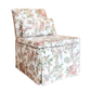 The Georgette Skirted Slipper Chair by Hickory Chair is an upholstered chair with a matching cushion, featuring fabric adorned with floral and bird patterns, shown against a white background. Experience the timeless elegance of this slipper chair at our West Palm Beach showroom.