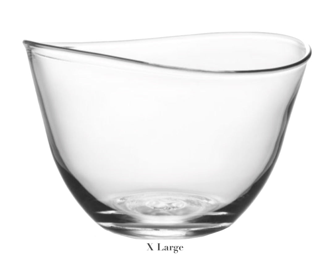 The Simon Pearce Barre Bowl Collection features an "X Large" glass bowl with a contemporary asymmetrical wave pattern, showcasing its unique design reminiscent of elegant Barre bowls.