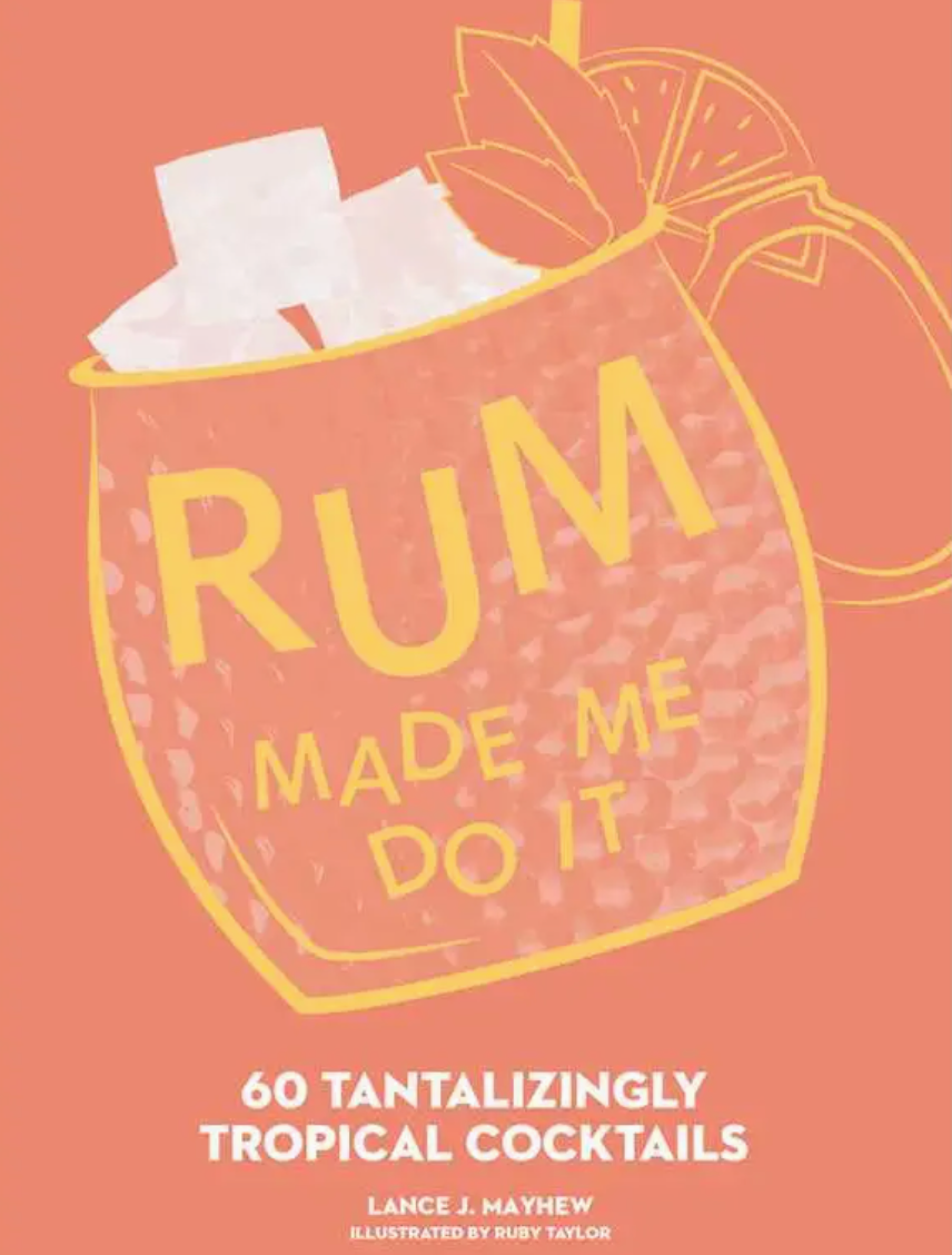 A copper mug filled with ice, citrus slices, and a straw is featured alongside the Simon & Schuster product “Rum Made Me Do It: 60 Tantalizingly Tropical Cocktails”—the ultimate tribute to rum cocktails and expert mixology.