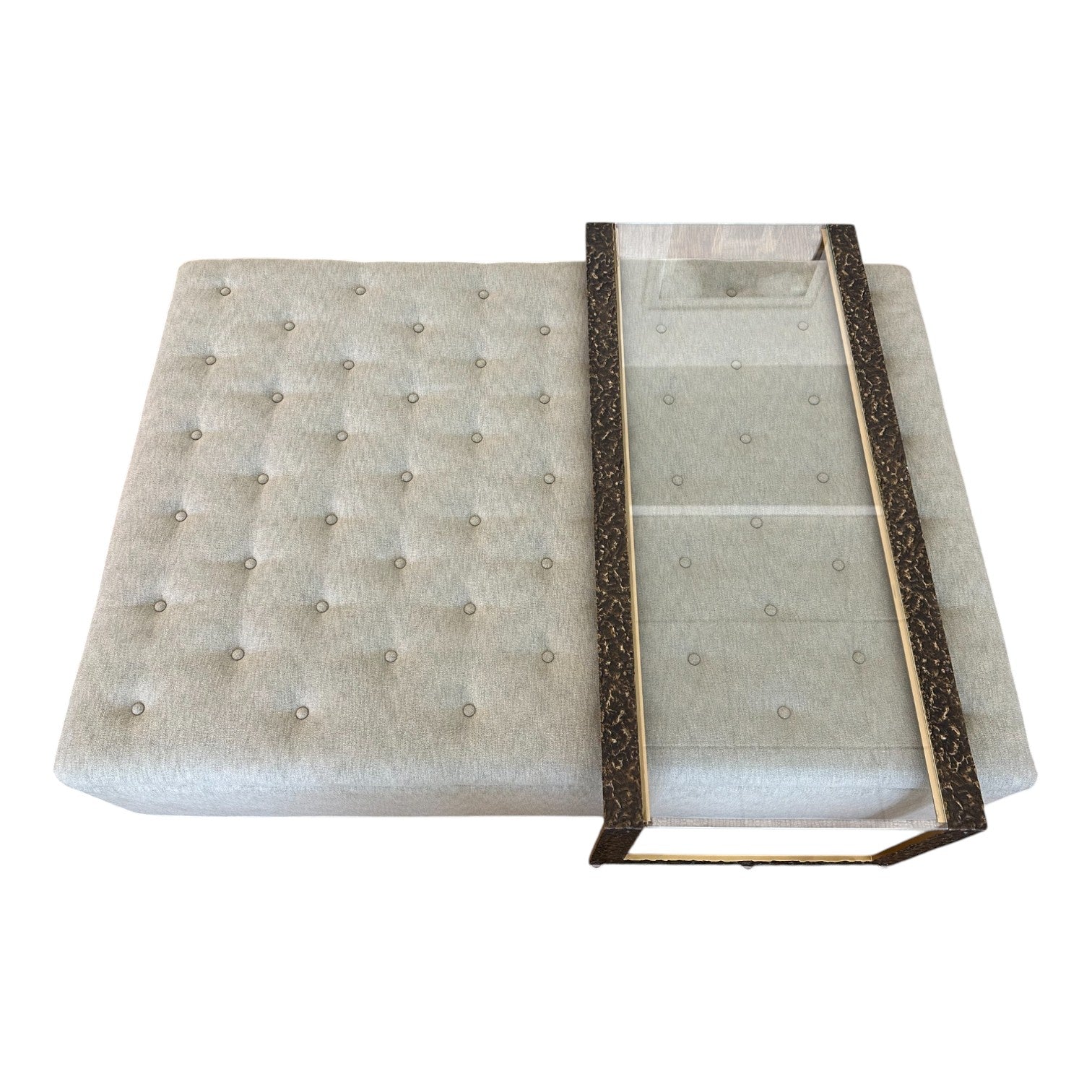 The HIVE Tufted Ottoman with Table in Landscape Kaki features a rectangular design and includes a glass-top metal tray partially placed on top.