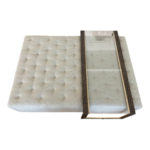 The HIVE Tufted Ottoman with Table in Landscape Kaki features a rectangular design and includes a glass-top metal tray partially placed on top.