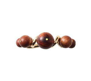 The Bois Napkin Ring in Brown/Gold by Kim Seybert features five polished wooden spheres arranged on a sleek gold base.