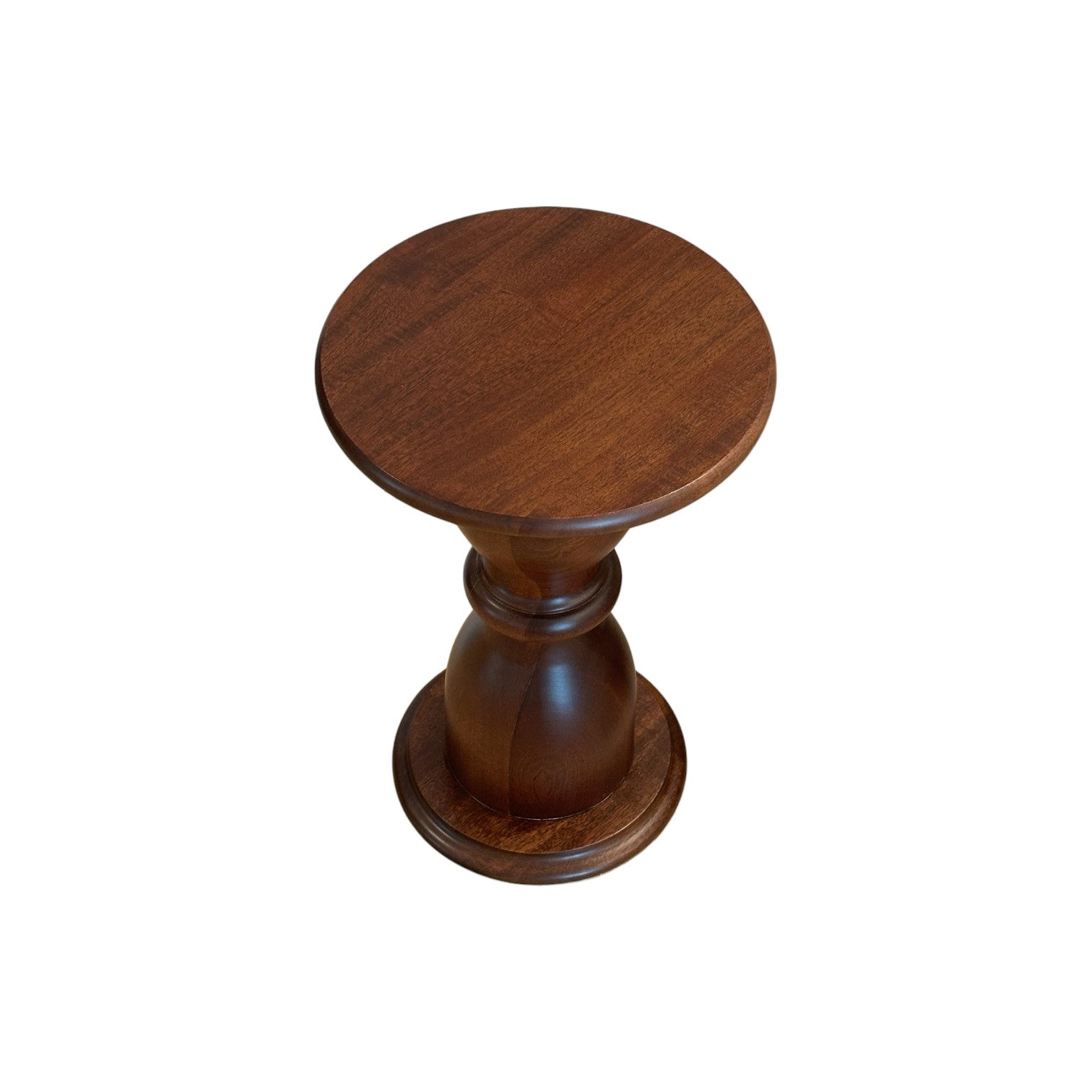 The Hickory Chair Spool Spot Table is a round solid Mahogany drink table with a smooth top and turned central support, offering a sculptural profile, shown on a white background.