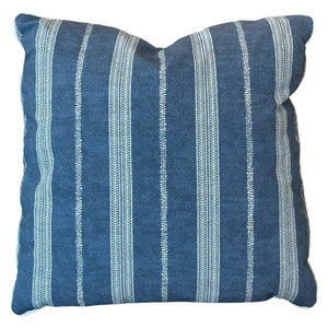 The Orlando Stripe Outdoor Pillow by Associated Design features blue fabric with vertical white stripes, a visible textured finish, and a slightly indented top center seam, crafted from premium materials for luxurious comfort.