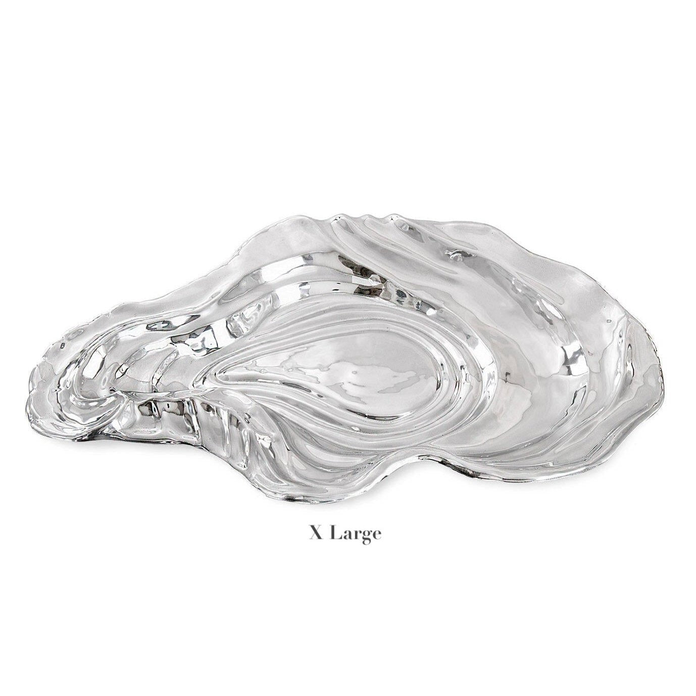The "X Large" Ocean Oyster Bowl from Beatriz Ball is a hand-polished silver aluminum alloy platter, oyster shell-shaped and shown on a white background.