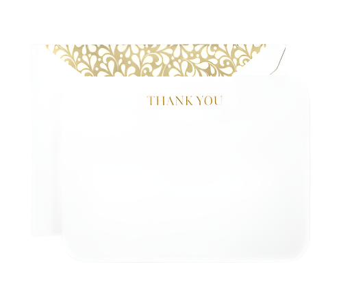 The Crane Gold Thank You Card Set features a white card with "THANK YOU" in gold and an open envelope with a Golden Swirls liner, all expertly crafted by Crane’s artisans.
