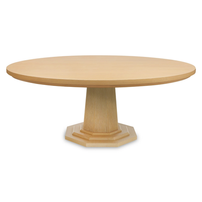 A round Haven Dining Table by Bunny Williams, crafted from light wood with a fluted pedestal base, is displayed against a plain white background.