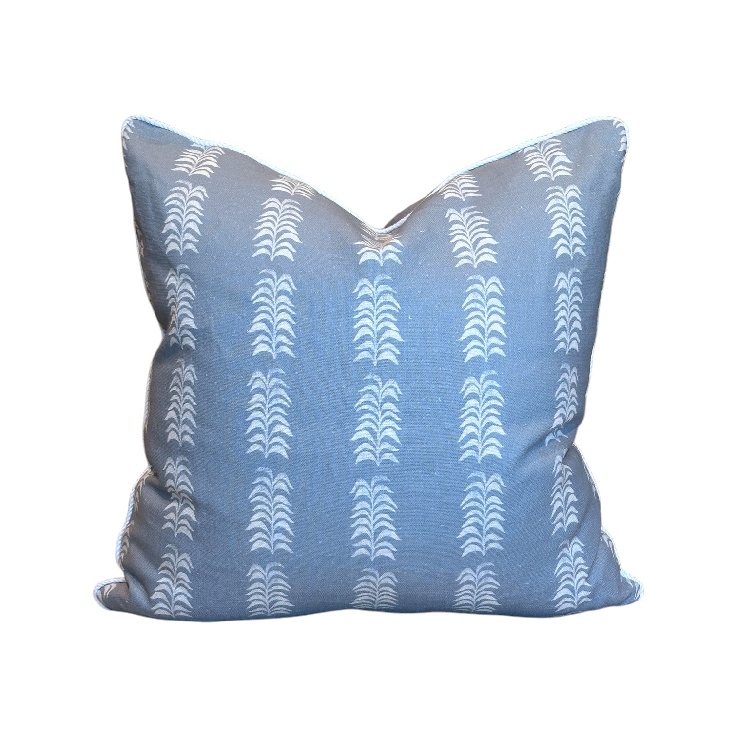 The HIVE Petite Frond Blue Pillow features a white, repeating vertical geometric pattern and is crafted from premium materials for lasting comfort, shown against a plain white background.
