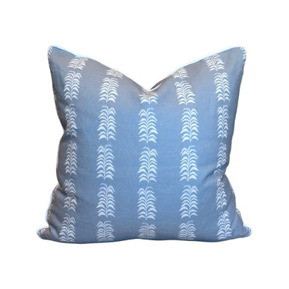 The HIVE Petite Frond Blue Pillow features a white, repeating vertical geometric pattern and is crafted from premium materials for lasting comfort, shown against a plain white background.