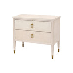 The Sydney Nightstand by Hickory Chair is a light wood dresser made from American Ash, with two drawers, gold handles, tapered legs, and gold feet accents, displayed against a white background.