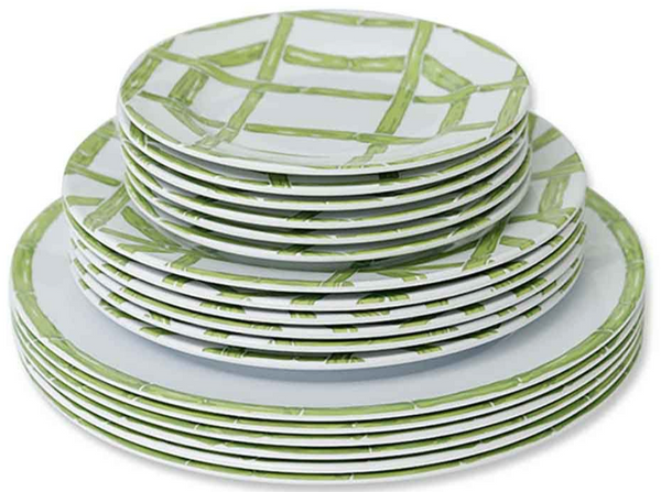 A stack of Pomegranate Inc. Green Bamboo Melamine Collection plates with a green geometric bamboo pattern on a white background, arranged in descending size order, perfect for creating a modern tablescape.