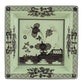 Ginori 1735’s Oriente Italiano Bario Decor Collection features a square porcelain dinner plate adorned with black floral and geometric patterns on a pale green background, showcasing a central botanical design and decorative borders inspired by classic Oriente Italiano motifs.