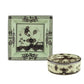 Two pieces from the Oriente Italiano Bario Decor Collection by Ginori 1735—a square plate and a round box, both crafted in pale green porcelain and adorned with black floral and decorative motifs in the signature elegant style—are displayed against a white background.