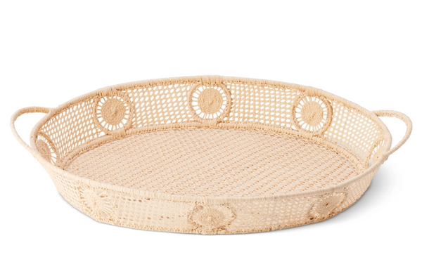 Discover the AERIN Raffia Round Tray by Aerin, a woven rattan tray with handles and a decorative circular pattern, perfect for elevating your coastal design.