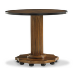 The Gottlieb Side Table by Bunny Williams features a round wooden top with a mahogany finish, a reeded column pedestal, and an octagonal base supported by small black feet.