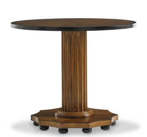 The Gottlieb Side Table by Bunny Williams features a round wooden top with a mahogany finish, a reeded column pedestal, and an octagonal base supported by small black feet.
