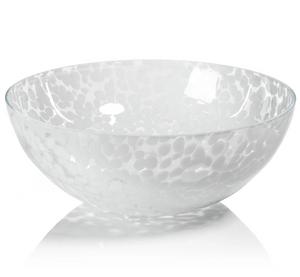 The Liguria Confetti Bowl by Zodax is a white glass bowl with a dappled pattern and subtle reflections, making it an elegant glass accent for sophisticated interiors.