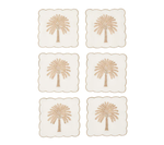 The Date Palm Cocktail Napkin Set by Kim Seybert features gold beaded palm trees on white—stylish hostess gifts and a chic match for your coastal décor.