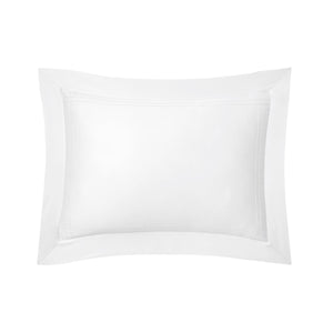 The Adagio Blanc Bedding Collection by Yves Delorme features a white rectangular pillow with a wide, stitched border, crafted from 500 thread count cotton sateen and adorned with quilted etoile embroidery, shown on a plain white background.