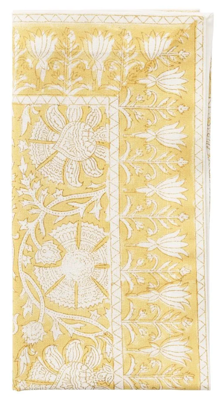 The Provence Napkin Set by Kim Seybert features folded yellow napkins with white floral and leaf embroidery—an eye-catching addition, perfect for pairing with a matching tablecloth.