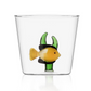 Part of the Marine Garden Drinkware Collection by Ichendorf Milano, this clear glass tumbler features a handmade yellow and black fish with green seaweed at the base—a signature piece of artistic charm.