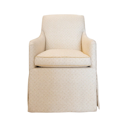Front view of the Lindsay Chair by Hickory Chair—an upholstered beige armchair with a skirted base and subtle dotted pattern, crafted as a sophisticated host chair. Its tight back construction offers refined support, making it an elegant addition to any game table setting. Isolated on a white background.